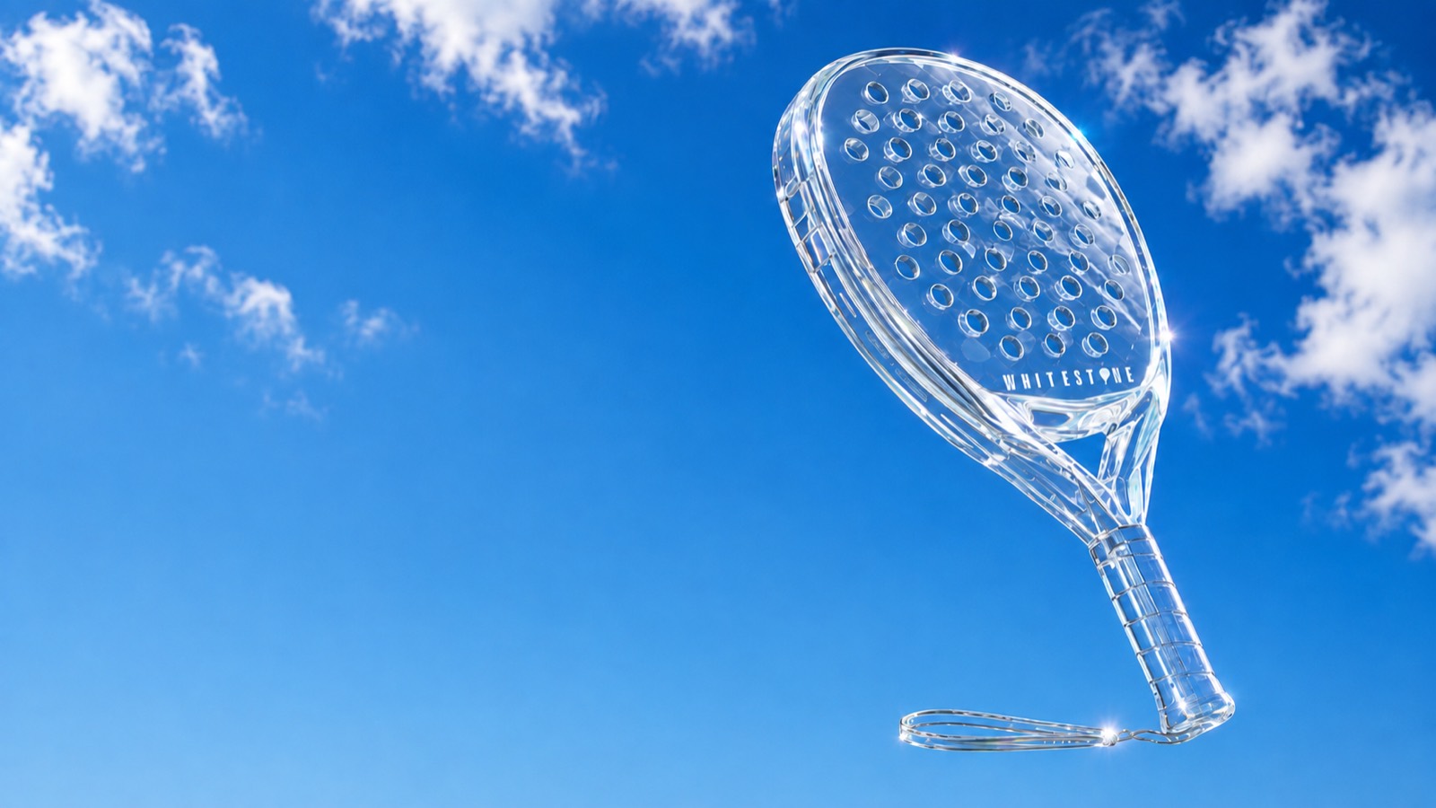 Crystal padel racket against a blue sky